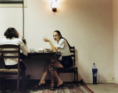 © RIP HOPKINS / AGENCE VUHOME AND AWAYOUZBEKISTAN, 200217/08/02Albina Ilyasova and Lena Tratimava in Tashkent's Valentina restaurant.Albina Ilyasöva is 20 years old. She works as a waitress whilst studying to be a police woman. Her mother is Korean and her father is Tatar, they came here together from Ukraine to study and stayed. She wants to leave for Odessa, Ukraine.Lena Tratimava is 19 years old. She works as a waitress whilst studying to be a police woman. Her mother's parents came here from Russia in 1953 and her father is an Ashkanaz Polish Jew from Ukraine whose parents were sent here by Stalin in 1937. She wants to leave for Russia.N°10650
