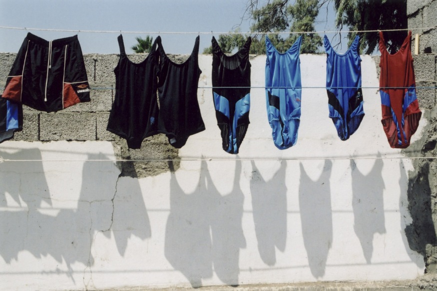 Iran, Babolsar, July 2002 - Beach, parking number one, bathing suit seller.