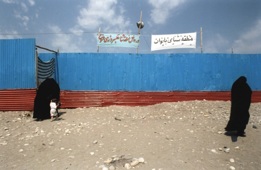 Iran, Nowshar, July 2002 - Hosseini beach, behind the fence private women place for swimming.