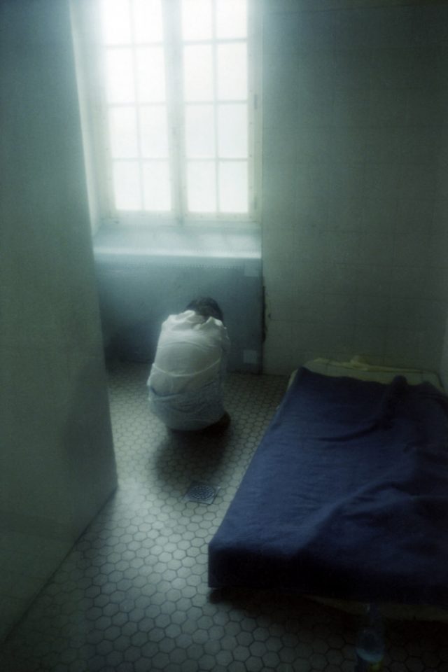 France, Seine-saint-Denis, Neuilly-sur-Marne, 1999 - Ville-Evrard Psychiatric Hospital. A patient in an isolation room.