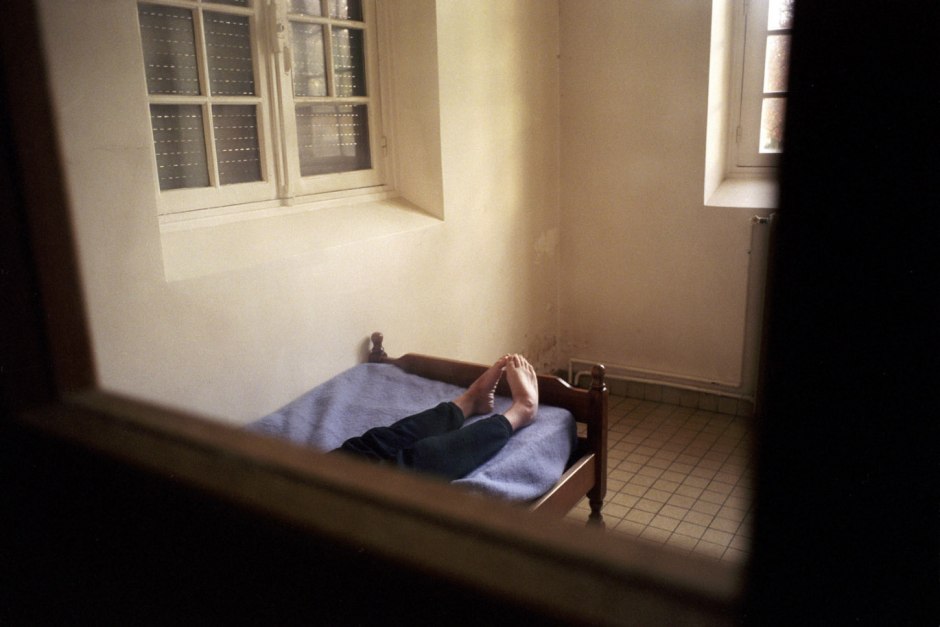 France, Seine-saint-Denis, Neuilly-sur-Marne, 1999 - Ville-Evrard Psychiatric Hospital. A patient in a room.