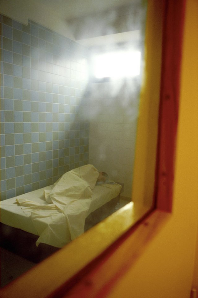 France, Seine-saint-Denis, Neuilly-sur-Marne, 1999 - Ville-Evrard Psychiatric Hospital. A patient in an isolation room.
