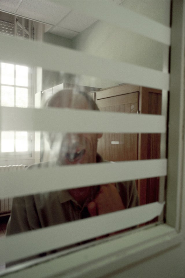 France, Seine-saint-Denis, Neuilly-sur-Marne, 1999 - Ville-Evrard Psychiatric Hospital. A patient isolated in a locked office.