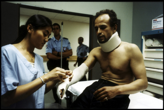 France, Marseilles, June 2002 - Emergency Room in Marseille's Nord Hospital. Illegal immigrant, under police surveillance.