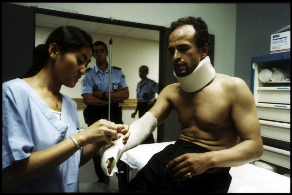 France, Marseilles, June 2002 - Emergency Room in Marseille's Nord Hospital. Illegal immigrant, under police surveillance.