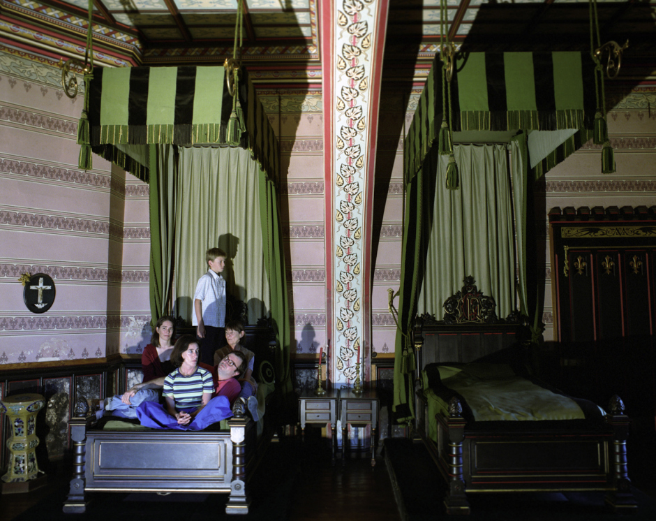 France, Bordeaux region, 2005Three generations of the Baritault family in the black room designed by the architect Viollet Le Duc who transformed the interior of the 14th century Ch‚teau de Roquetaillade fortress in the nineteenth century. He even devised and installed a sophisticated heating system by which hot air was injected into the voluminous rooms.France,  Le Bordelais, 2005Trois gÈnÈrations de la famille Baritault dans la chambre noire dessinÈe par Viollet Le Duc, l'architecte qui au 19Ëme siËcle a transformÈ les intÈrieurs du Ch‚teau de Roquetaillade qui date du 14Ëme siËcle. Il a mÍme conÁu et installÈ un systËme de chauffage qui injectait de l'air chaud dans les piËces volumineuses.Rip Hopkins / Agence VU