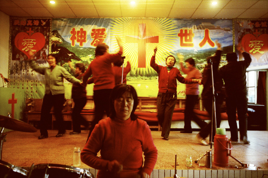 China, Datong, 2006 - Miners rehearsing a Christmas show in the protestant church of the Datong coal mine.