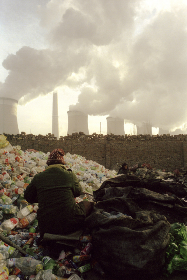 China, Datong, 2006 - A woman select wastes for recycling near the poxer station of Datong in Shanxi.Shanxi province produce more than 30% of China's coal.