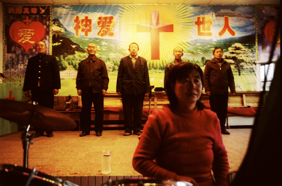 China, Datong, 2006 - Miners rehearsing a Christmas show in the protestant church of the Datong coal mine.