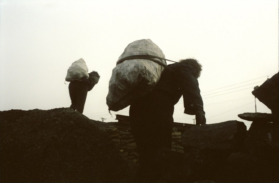 China, Datong, 2006 - Mr Wang. He lost a leg in the mine. Without any compensation, or job, he steals the coal on the slag heaps of the state mine. With his father and wife, he gets out a hundred of kilos per day he sells to his neighbours. He earns a few euros per month.