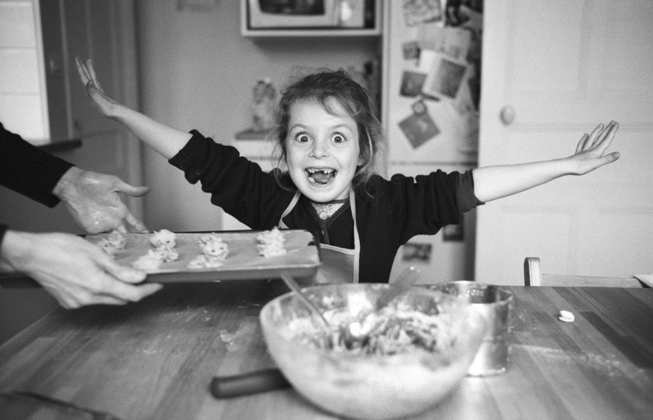 France, Villiers-le-Bel , April 2005 - Adèle in the kitchen.