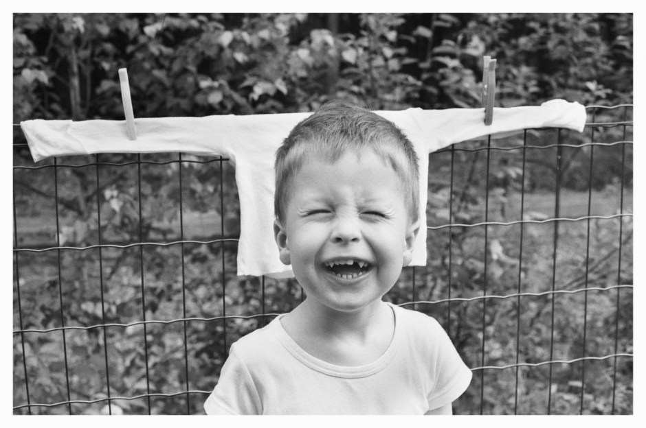 France, Montdidier, may 2008 - Cheeky boy laughing. Simon.