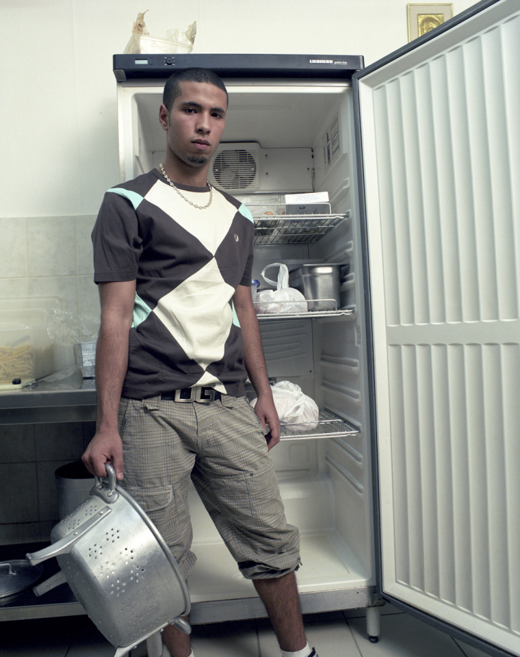 France, Behren lËs Forbach, 2007Jaouad, 19 years old. His parents are Moroccan. His father was a miner. His mother is a housewife. He works ni a pizzeria to save enough money to open a hairdressing salon.France, Behren lËs Forbach, 2007Jaouad, 19 ans. Ses parents sont marocains. Son pËre Ètait mineur. Sa mËre est femme au foyer. Il travaille dans une pizzeria afin d'Èconomiser assez pour ouvrir un salon de coiffure.  © Rip Hopkins / Agence VU