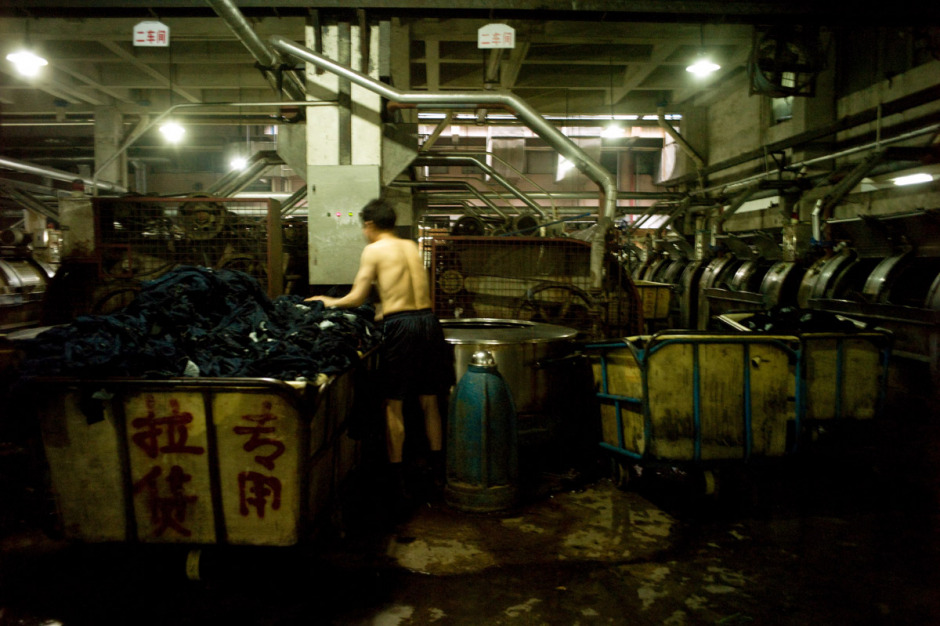 China, Xintang, May 2011 - In the big industrial estate of Xi Zhou, the cleaning factories are numerous. The partial filtering of waste awater does not eliminate everything, and the very polluting discharges of heavy metals have been proved: manganese, cadmium (up to 128 times the authorized dose), mercury, chromium, lead... When we pretend to be costumers worried about antipollution standards respect, the answer is plain: "We could respect them, but it would be more expensive. We can make other arrangements." All of Xi Zhou is bathed in a bluish vapour. 200 000 of the 700 000 inhabitants of Xingtang are migrant workers, the mingongs. Easily exploitable, they form the "first line", the one that gets through the hardest works and the most dangerous for health.
