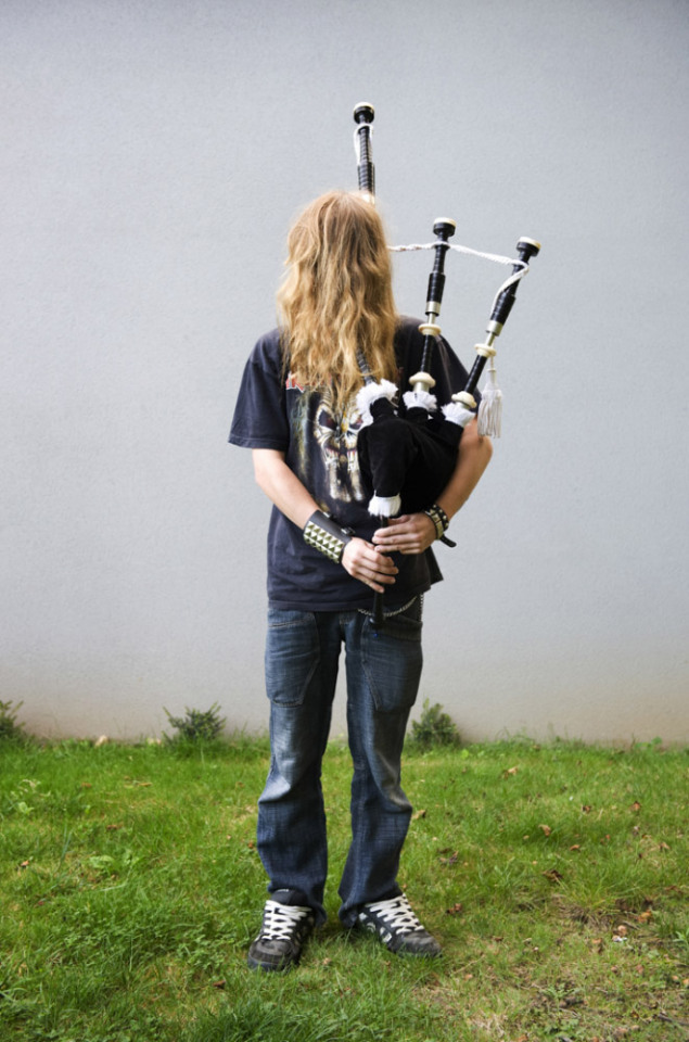 France,  01 October 2009 - What would be a faceless world ? Young man playing bagpipes.