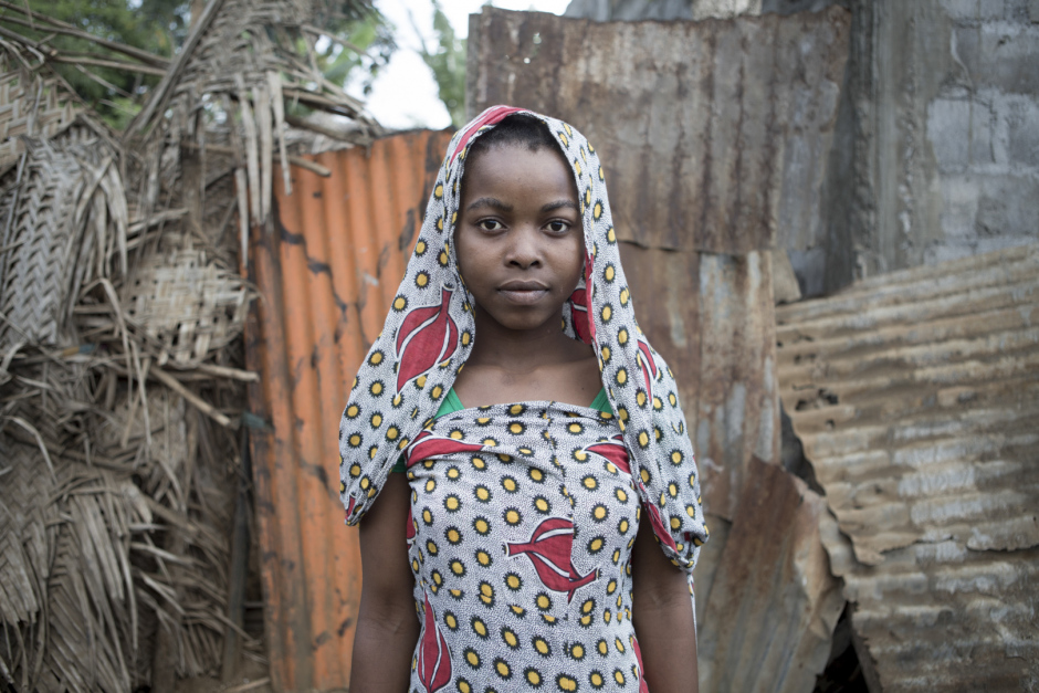 Comoros, Mohéli Island, Fomboni, October 2015Laina Arkane, 15 years old."When I was 13 years old, a man came to our place, asking for my hand and my family accepted to give us money. Then, the man came to sleep with me and I refused. He came back and he succeed to sleep with me, I don't even know how he does it, I think he used a charm ! I end up being pregnant and I hated him for that. He never maried me, he asked me to left school but I refused. I am in second year in middle school and I will become a teacher. My family help me with my child, who is one and a half."