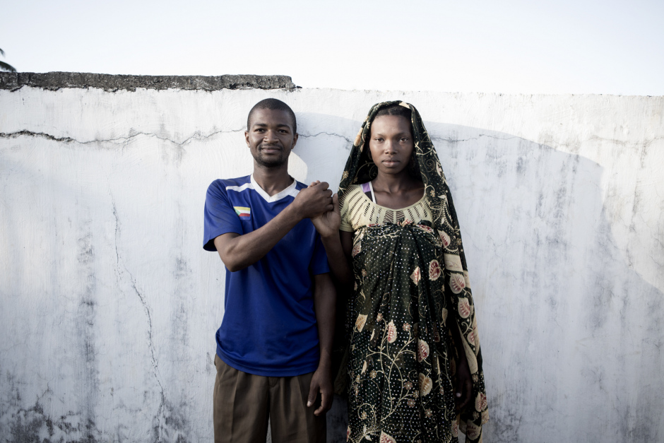 Comoros, Anjouan Island, Kiyo, October 12 2015Charfia Combo, 17 years old et Chaihani Darahima, 21 years old.Two years ago, Chahani, who were working at the Volo-volo market in Moroni, were in holidays in Anjouan, and met Charfia."She was very beautiful and I fell in love. I asked for her hand to his parents, but they refused because I was poor. So I get back to Moroni to male money, and when I had enough I came back to Anjouan to pay the dowry, and they accepted. Charfia too, because she loved me too. We get maried and I moved in Anjouan, because life in Moroni is too expensive. Here, I am a goat farmer and a grower. I have no regret about quitting my job, because I am very happy with Charfia ! We have a one year old child. Charfia take care of him at home. She never studied, so she doesn't go to school."
