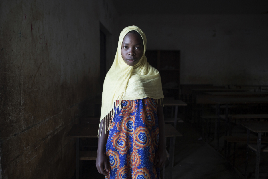 Comoros, Anjouan island, Kiyo, October 12 2015Faouzia Daoud, 13 years old."I had my periods at 9 years old. After the two weeks of the beginning of puberty, during when I stay at home as wants the tradition, a man came to our place. He was a builder. I loved him because he brought me gifts, as hair products, shoes and money. As I don't have any father, it helped my family and me. I had an unwanted pregnancy last year, and we get married. I gave birth at home, with my mum. The kid is fine and he is 8 months old now. My husband left to find a job in Mayotte, but for now he hasn't fine anything. I would like to go back to school, but with my baby I don't know what to do."