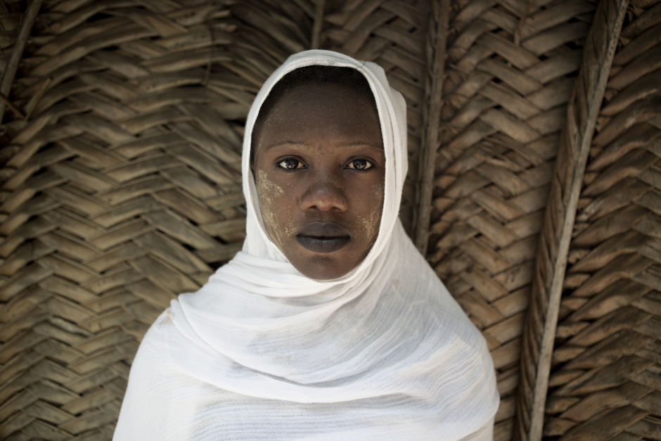 Comoros, Anjouan Island, Nounga, October 10 2015Asmina Moussa, 17 years old."My parents maried me when I was 13, because they suspected me to see boys, but I had never knew any man. They choose an older husband that I knew already because he was my uncle's friend, and I had no choice but accepted it. We had two children, who are now 2 and 3 years old, and we divorced because he was rarely home. I maried another man, but we divorced quicly because he wasn't taking care of the children at all. Now, I'm alone with the kid and I don't work. I quit school early and I would like to go back to it, but my father wants to send me to Moroni looking for another husband. So I'm waiting for a new husband."