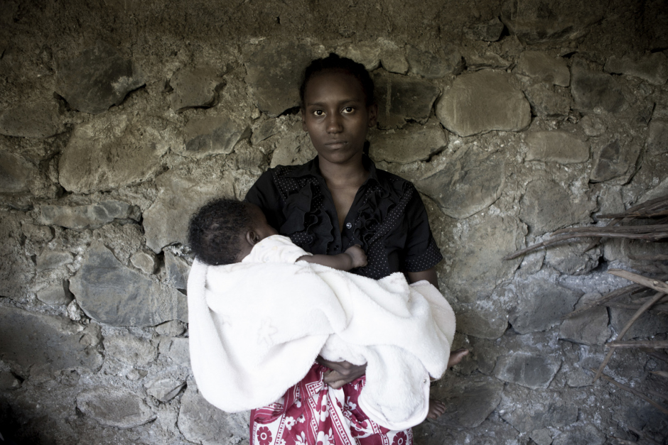 Comoros, Anjouan Island, Hachipenda, October 11 2015Najida Minhadj, 16 years old."I was seing a man, a clothes seller from Moroni, who were in Anjouan for holidays. I get pregnant from him. He said he would marry me after the child birth but he hasn't came back yet. My child is now 3 months old. I think he will came back...I was in first year in middle school, but I had to stop because I hadn't enough money. The father send us money, time to time, so for now I can take care of my kid."