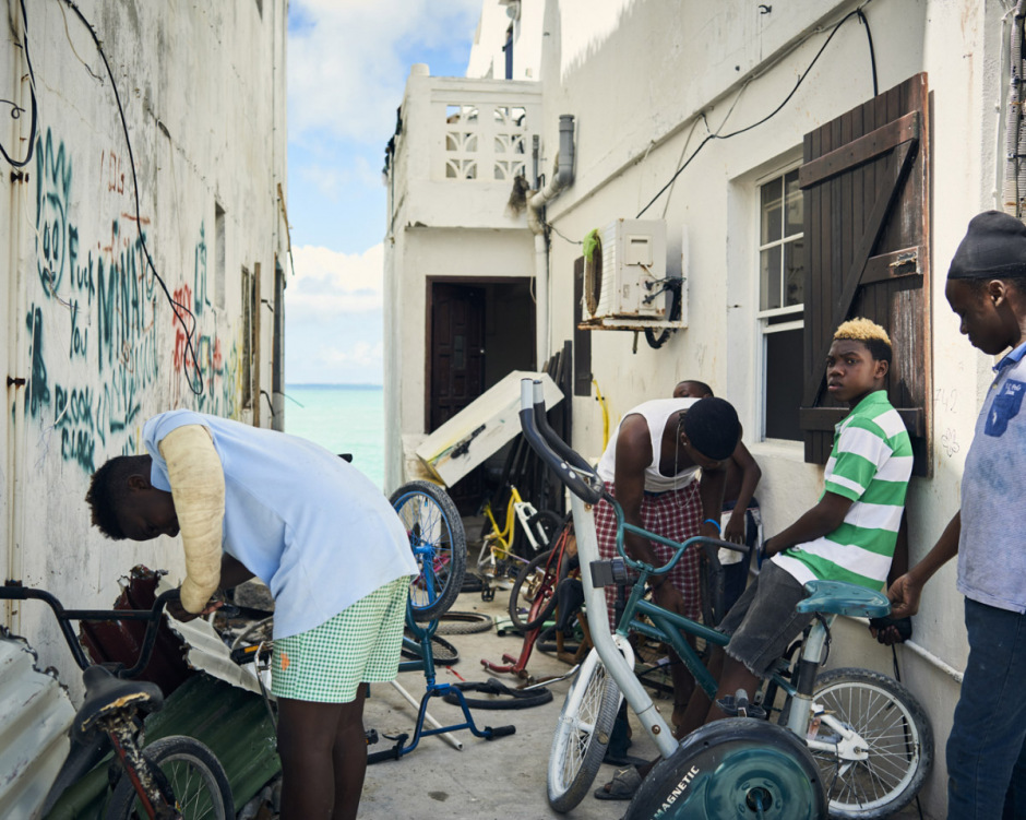 Antilles, Saint-Martin, 18 September 2017 - Irma Hurricane. In the Sandy Ground district. Kids are fixing bikes.