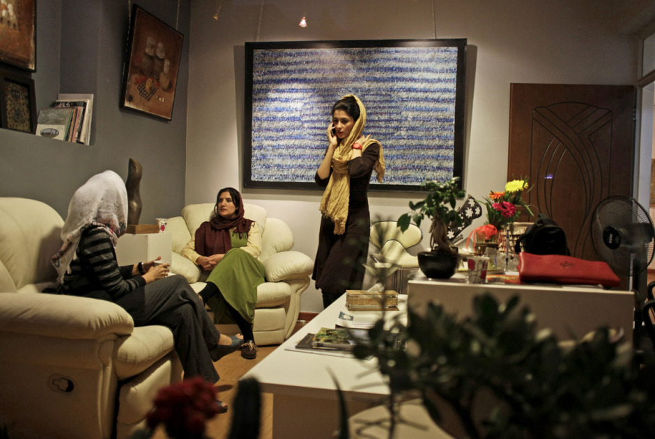 Iran, Isfahan, 16 August 2013 - Young artists in the office of the gallery owner, at the Apadana Gallery.