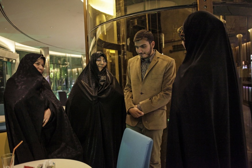 Iran, Isfahan, November 2nd 2015 - Khastegari is the first step of the traditional Iranian marriage process.Every afternoon, hotel's coffee-shop of Isfahan are crowded by families who come to introduce their sons and daughers, in the hope of a future wedding. Kowsar Hotel. Maedeh Sadat , 21 years old, meets Hossein, 23 year old. At the end of the meeting, if they have affinities, they will meet again at the girl's home.