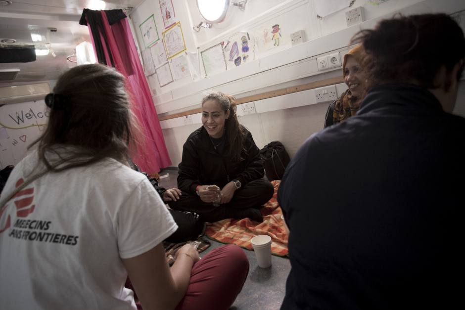 Mediterranean Sea, October 18th, 2017Hasna, 27 years old, in the "shelter" of the Aquarius during an awareness session with the midwife of MÈdecins Sans FrontiËres.Hasna is Maroccan and had left her country two years ago following the economic crisis. She went to find fortune in Lybia with her childhood friend Rajaa. "But, in Lybia, there is no life : militias make life impossible to people We can't go buying some bred without being arrested and getting robbed some money, they can kill you for nothing. In addition, I was working as hairdresser and I earned very few. We had escaped murder but we have seen so many people getting shot in front of our eyes.There were explosions everywhere, somtimes we didn't eat for two day, you don't know if you're gonna live or not, so you don't care about anything... We just wanted to have a simple life, without being afraid of dying every night. So we decided to take the boat. Everybody talk about these boats... We got into it. We saw this mother with her two daughters. I cried, because they are boats of death...But if she leave, even with her little girls, if we are gone, if I left my 6-year-old daughter and left her to my mother, it's because we don't have other choice... We leave our families, our country, everything. Because life over there is just not possible anymore..."Mer MÈditerranÈe, 18 octobre 2017Hasna, 27, dans le ?shelter?de l?Aquarius pendant une session de sensibilisation avec la sage-femme de MÈdecins Sans FrontiËres. Hasna est marocaine et a quittÈ son pays il y a deux ans suite ‡ la crise Èconomique. Elle est allÈe chercher fortune en Libye avec son amie d?enfance Rajaa. ?Mais en Libye il n?y a aucune vie : les milices rendent la vie impossible aux gens. On ne peut pas aller acheter du pain sans Ítre arrÍtÈes et se faire voler de l?argent, ils peuvent te tuer pour rien. En plus je travaillais comme coiffeuse et je gagnais trËs peu. On a ÈchappÈ au meurtre mais on a vu tellement de gens se f