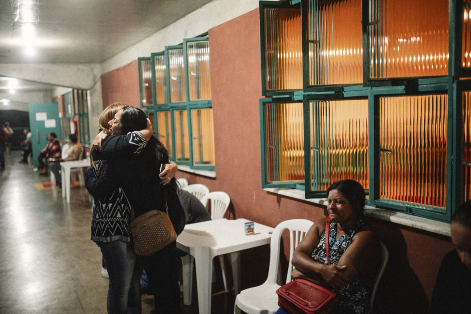 Brazil, Corrego do Feijão, 26 January 2019 - Relatives hug each other in a support center for those affected by the dam burst. Elisa Aparecida’s husband, Rodinei dos Santos, is missing.