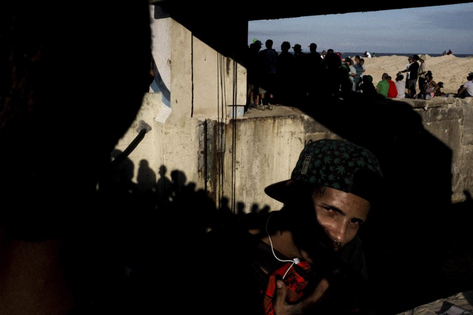 Brazil, Rio de Janeiro, May 6, 2017 - In the bowels of Brazilian inequality, in the difficulty of remembering our history, our origins, anomia generates the feeling of that « which must not be named ». It occurs when individuals feel pressured to violate norms.Young man on the beach of Ipanema.