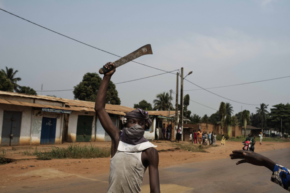 Central African Republic, Bangui, 11 January 2014In the Combattant district - mostly Christian - a group of men celebrating the return of Alexandre Ferdinand N'Guendet, President of the CNT (Central African Republic's Transitional Assembly) and Transitional President after the resignation of Michel Djotodia.République Centrafricaine, Bangui, 11 Janvier 2014Dans le quartier Combattant, à majorité chrétienne, des hommes fêtent le retour d'Alexandre Ferdinand N'Guendet, Président du CNT (Conseil National de Transition) et Président de la transition après la démission de Michel Djotodia.Michael Zumstein / Agence VU
