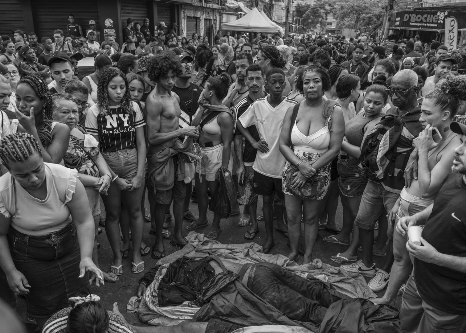 Brazil, Rio de Janeiro, 29 October 2025 - Dozens of dead bodies are laid out in São Lucas Square in the Complexo da Penha neighborhood while family members and community residents shout in protest against police violence. The square has become a base of operations for the Forensic Medical Institute to recover the bodies for examination. This turbulent day follows the deadliest police operation in the history of Rio de Janeiro, in which at least 126 people were killed.