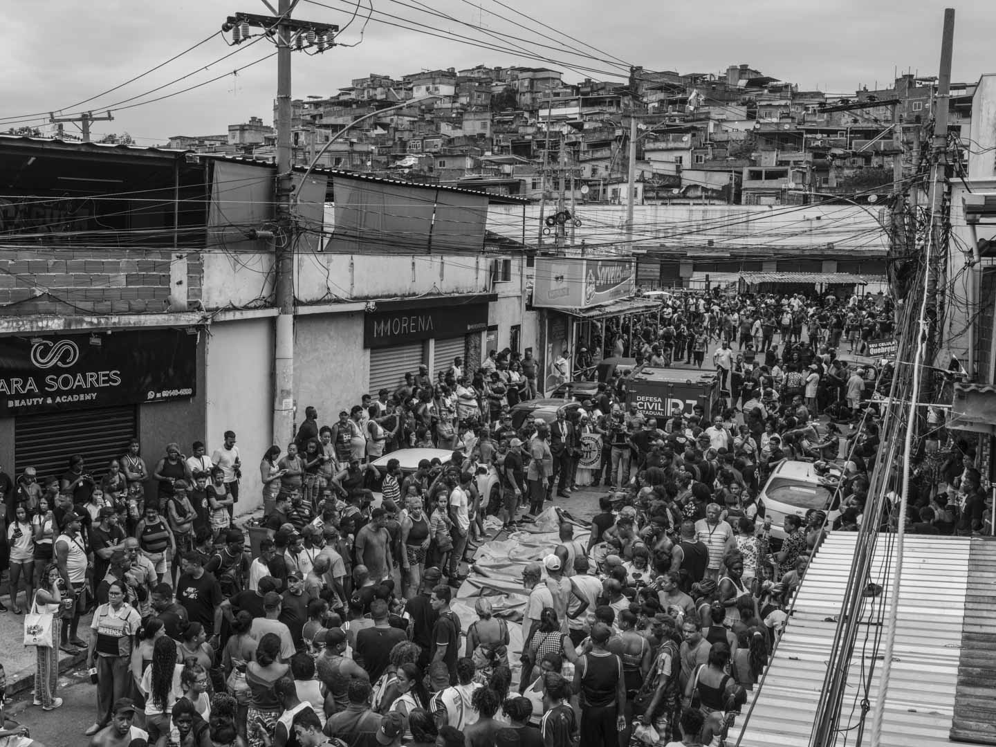 Brazil, Rio de Janeiro, 29 October 2025 - Dozens of dead bodies are laid out in São Lucas Square in the Complexo da Penha neighborhood while family members and community residents shout in protest against police violence. The square has become a base of operations for the Forensic Medical Institute to recover the bodies for examination. This turbulent day follows the deadliest police operation in the history of Rio de Janeiro, in which at least 126 people were killed.