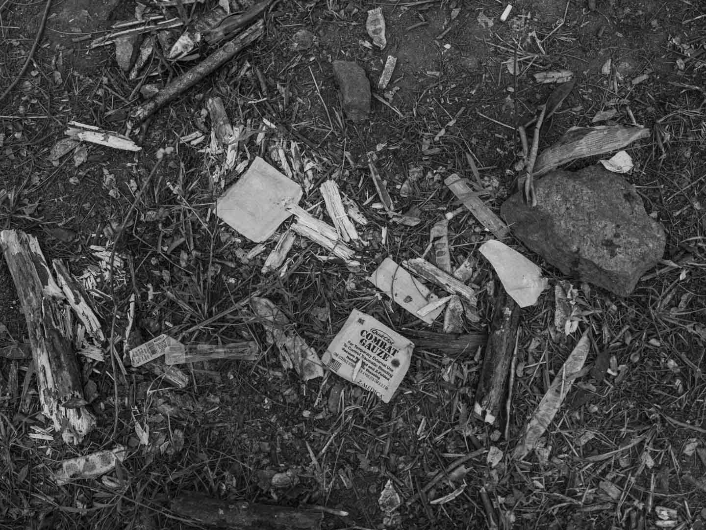 Brazil, Rio de Janeiro, 29 October 2025 - Traces of blood and weapons used in combat with security forces on the dirt floor in the middle of a forest separating the Penha Complex from the Alemão Complex after the deadliest police operation in the history of Rio de Janeiro, where at least 126 people were killed.