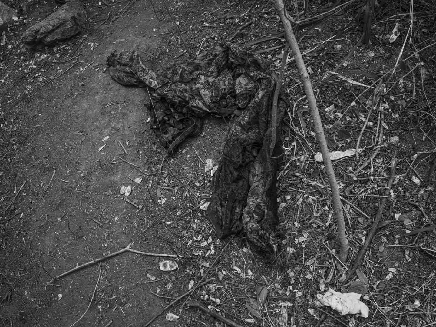 Brazil, Rio de Janeiro, 29 October 2025 - Traces of blood and weapons used in combat with security forces on the dirt floor in the middle of a forest separating the Penha Complex from the Alemão Complex after the deadliest police operation in the history of Rio de Janeiro, where at least 126 people were killed.